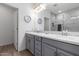 Stylish bathroom boasts a double vanity, a large mirror and updated finishes at 2425 W Bronco Butte Trl # 2011, Phoenix, AZ 85085