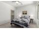 Cozy bedroom features a ceiling fan, walk-in closet, and comfortable bed with patterned cover at 2425 W Bronco Butte Trl # 2011, Phoenix, AZ 85085