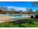 Large community pool offers a refreshing retreat with ample lounge space and beautiful landscaping at 2425 W Bronco Butte Trl # 2011, Phoenix, AZ 85085