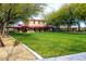 Picturesque exterior view of the home, framed by mature trees and a lush green lawn for outdoor activities at 2425 W Bronco Butte Trl # 2011, Phoenix, AZ 85085
