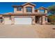 Two-story home featuring a three car garage, neutral stucco exterior, and a well-maintained front yard at 26286 N 45Th Pl, Phoenix, AZ 85050