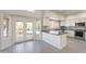 Well-lit kitchen with gray counter tops, stainless steel appliances, and access to the patio at 26286 N 45Th Pl, Phoenix, AZ 85050