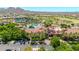 Beautiful aerial view showcases community swimming pool, tennis courts, and parking in a gated community at 27606 W Tonopah Dr, Buckeye, AZ 85396