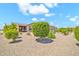 View of the meticulously landscaped backyard of this lovely home featuring desert-friendly flora at 27606 W Tonopah Dr, Buckeye, AZ 85396