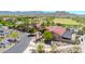 Aerial view of the clubhouse with parking and golf course access at 27606 W Tonopah Dr, Buckeye, AZ 85396