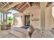 Entrance to the Copper Canyon Golf Club features tile roofing, brick accents, and mature desert landscaping at 27606 W Tonopah Dr, Buckeye, AZ 85396