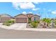 Attractive single-story home with a well-maintained front yard and a two-car garage at 27606 W Tonopah Dr, Buckeye, AZ 85396