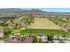 Aerial view of the golf course showing putting areas and surrounding residential area at 27606 W Tonopah Dr, Buckeye, AZ 85396