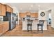 Eat-in kitchen with granite countertops, wood cabinets, and stainless steel appliances at 27606 W Tonopah Dr, Buckeye, AZ 85396