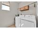 Bright Laundry Room with washer, dryer, and a window at 27606 W Tonopah Dr, Buckeye, AZ 85396