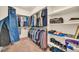 Spacious walk-in closet with custom shelving and ample storage at 27606 W Tonopah Dr, Buckeye, AZ 85396