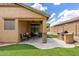 Charming backyard with a covered patio, artificial turf, and a built-in outdoor grill at 29751 N 119Th Ln, Peoria, AZ 85383