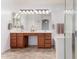 Bright bathroom features a double vanity, a large mirror, and white countertops at 29751 N 119Th Ln, Peoria, AZ 85383