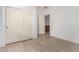 This bedroom features neutral flooring, a closet, and a doorway at 29751 N 119Th Ln, Peoria, AZ 85383