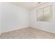 This bedroom features neutral flooring and one window at 29751 N 119Th Ln, Peoria, AZ 85383
