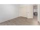 This bedroom features neutral flooring, a closet, and a doorway at 29751 N 119Th Ln, Peoria, AZ 85383