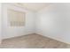 This bedroom features neutral flooring and one window at 29751 N 119Th Ln, Peoria, AZ 85383