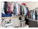 Organized walk-in closet featuring shelving, hanging rods, and ample storage space at 29751 N 119Th Ln, Peoria, AZ 85383