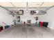 Organized garage space with overhead racks for storage and ample room for vehicles at 29751 N 119Th Ln, Peoria, AZ 85383