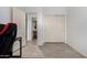 Bright hallway featuring wood-look tile floors and closet with sliding doors at 29751 N 119Th Ln, Peoria, AZ 85383