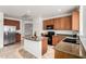 Modern kitchen featuring stainless steel appliances, granite countertops, and tile floors at 29751 N 119Th Ln, Peoria, AZ 85383