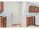 Convenient laundry room with tile floors, ample counter space, and storage cabinets at 29751 N 119Th Ln, Peoria, AZ 85383