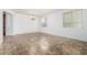 An inviting room with tile flooring, neutral walls, and large windows at 29751 N 119Th Ln, Peoria, AZ 85383