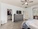 Spacious main bedroom with ensuite bathroom, walk in closet, wood floors and ceiling fan at 29751 N 119Th Ln, Peoria, AZ 85383