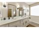 Bright bathroom featuring a double vanity with black accents, offering a modern and stylish design at 3067 E Merlot St, Gilbert, AZ 85298