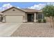 Charming single-story home featuring a well-manicured yard, neutral color scheme, and attached two-car garage at 3067 E Merlot St, Gilbert, AZ 85298