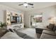 Cozy living room with a large built-in entertainment center and sliding glass doors leading to the backyard at 3067 E Merlot St, Gilbert, AZ 85298