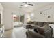 Comfortable living room with a sectional sofa, sliding glass doors to the backyard, and natural lighting at 3067 E Merlot St, Gilbert, AZ 85298