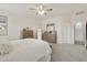 Spacious main bedroom with carpet floors, a dresser, and a ceiling fan, providing a relaxing atmosphere at 3067 E Merlot St, Gilbert, AZ 85298