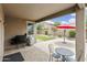 Covered patio with BBQ grill and paver flooring, plus a view of the backyard and landscaping at 3067 E Merlot St, Gilbert, AZ 85298