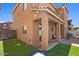 Backyard features a covered patio, artificial turf, and a built in fire pit at 318 S Leandro --, Mesa, AZ 85208