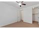 Bedroom showcases ceiling fan, neutral carpet, and a walk in closet at 318 S Leandro --, Mesa, AZ 85208