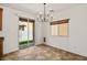 Bright dining area features tile floors, natural light, and a modern chandelier at 318 S Leandro --, Mesa, AZ 85208
