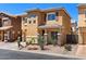 Two-story home featuring neutral stucco, a desert landscape, an attached garage, and a tiled roof at 318 S Leandro --, Mesa, AZ 85208
