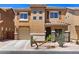 Two-story home featuring neutral stucco, a desert landscape, an attached garage, and a tiled roof at 318 S Leandro --, Mesa, AZ 85208