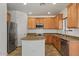 Well-lit kitchen featuring stainless steel appliances, granite countertops, and maple cabinets at 318 S Leandro --, Mesa, AZ 85208