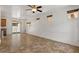Bright and open living room with ceiling fan, three windows, and tile flooring throughout at 318 S Leandro --, Mesa, AZ 85208