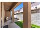 Covered patio offers outdoor living space with seating area and artificial grass at 318 S Leandro --, Mesa, AZ 85208