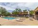 Community pool area features lounge chairs and a well-maintained pool perfect for relaxing at 318 S Leandro --, Mesa, AZ 85208