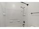 White tiled shower with built in shelves and matte black fixtures at 318 S Leandro --, Mesa, AZ 85208