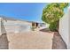 Low maintenance backyard featuring gravel landscaping, mature trees, and fenced perimeter at 3433 E Sandra Ter, Phoenix, AZ 85032
