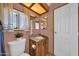 Bathroom featuring a granite countertop vanity and window with natural light at 3433 E Sandra Ter, Phoenix, AZ 85032