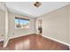 Bedroom featuring hardwood floors, large window, and ensuite bathroom at 3433 E Sandra Ter, Phoenix, AZ 85032