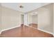 Bedroom featuring hardwood floors, mirrored closet, and natural light at 3433 E Sandra Ter, Phoenix, AZ 85032