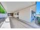 Spacious carport providing covered parking with direct access to the home's screened-in entrance at 3433 E Sandra Ter, Phoenix, AZ 85032