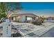 Inviting single-story home featuring covered parking, desert landscaping, and a charming mailbox with street number at 3433 E Sandra Ter, Phoenix, AZ 85032